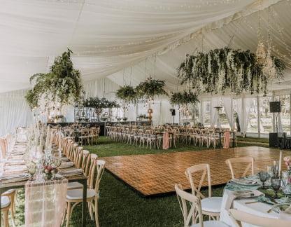 Milestone birthday party with coordinated tables, decor, and entertainment